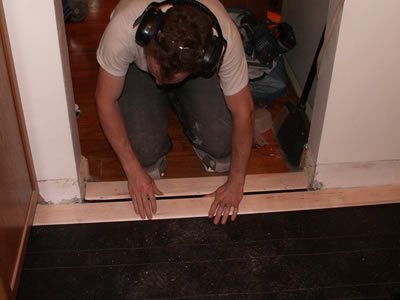 Mike Stalkfleet installing a rustic (third grade) maple floor in a kitchen