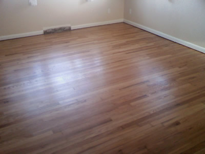 Removed carpet and glued-down parquet to refinish this original red oak hardwood floor in Iowa City